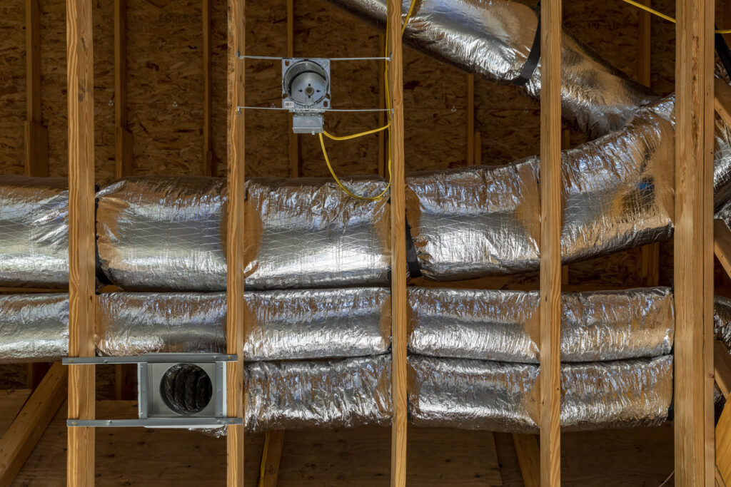 Construction new home of installed of HVAC vent in roofing.